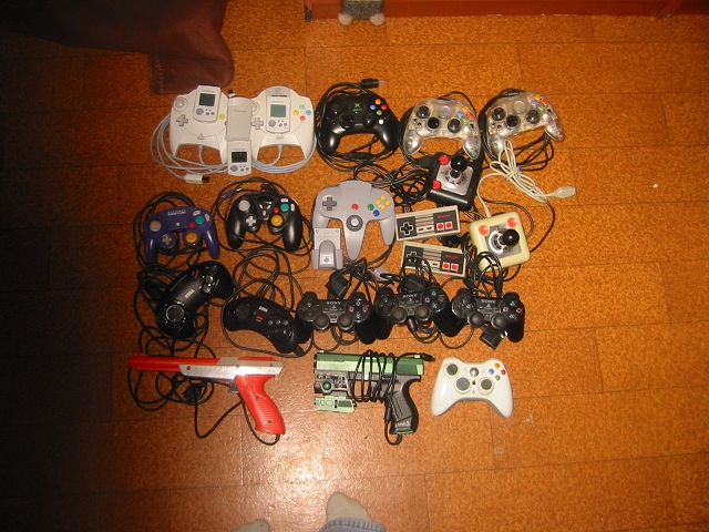 Controllers in picture:<br /><br />Dreamcast x 2<br />Xbox1 x 3<br />Gamecube x 2<br />N64 x 1<br />NES x 2<br />Commodore/Atari joysticks x 2 (Tac-2)<br />Megadrive x 2 (1 x 6 button)<br />Playstation 2 x 3<br />Nintendo 8-bit Zapper x 1<br />Xbox1 - Gun<br />Xbox 360 wireless x 1<br />Dreamcast VMU x 3