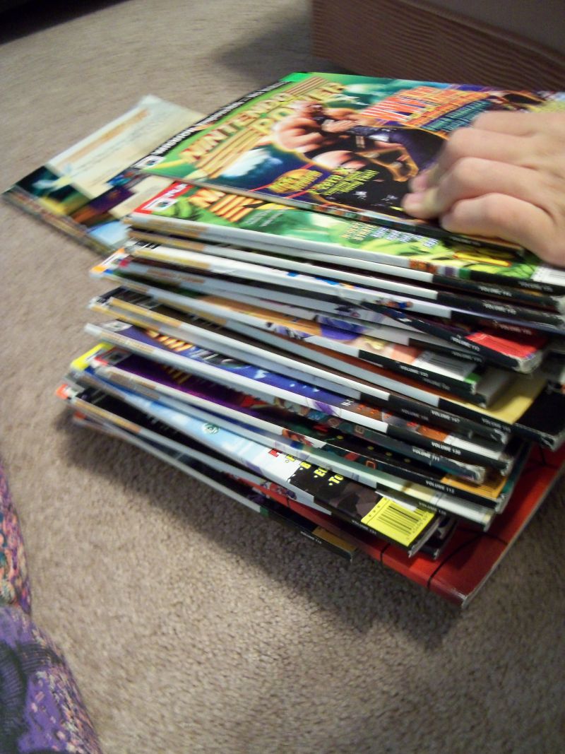 Stack of Nintendo power 2 of them have ripped covers.