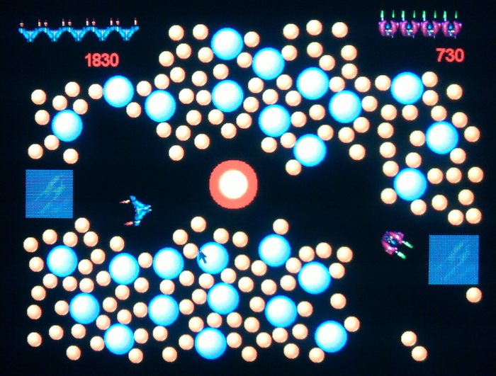 AVOID THE EXPLODED SUN. SHOOT CHAIN REACTION BLUE BOMBS FOR EXTRA POINTS, MAYBE HIT OPPONENT.