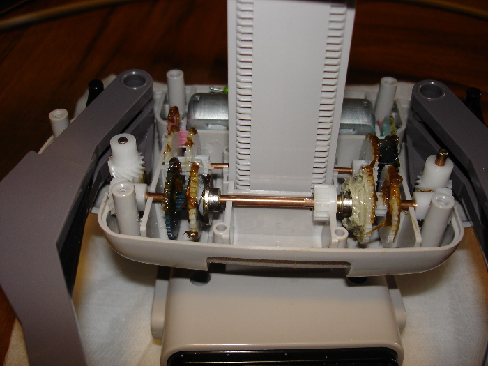 BEIGE GLUE KEEPS BOTH GEARS LOCKED TOGETHER. GREASED UP READY TO BE BUTTONED UP.
