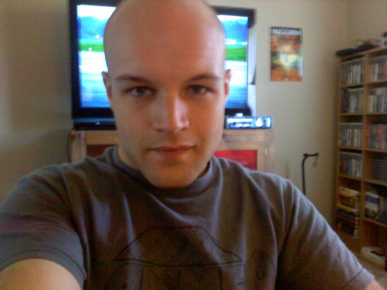 In the room with my 50" Samsung rig behind me and the bookcase of games in the corner
