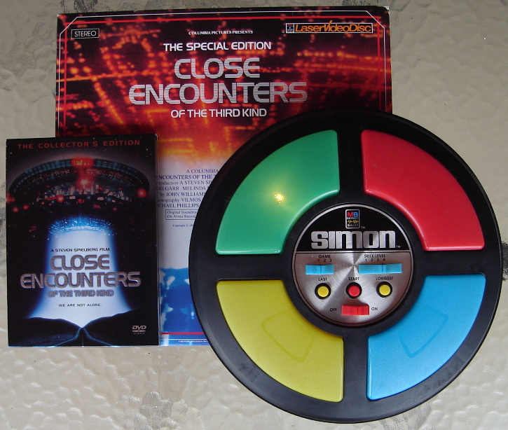 Simon with Close Encounters DVD and Laser Disc.jpg