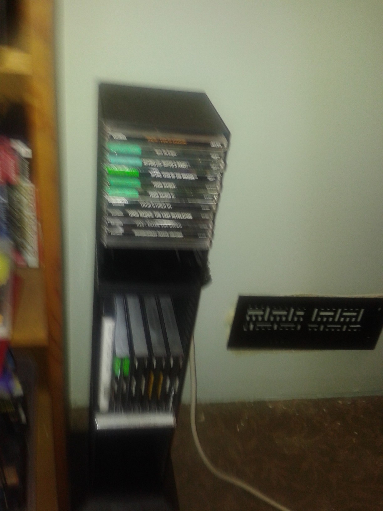 Forgot to put this in. This is right next to the bookshelf and holds my PS1 games.